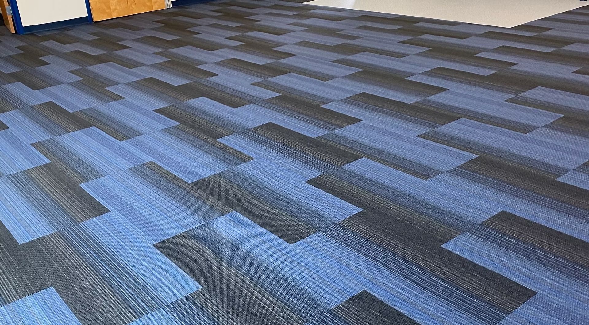 Blue patterned commercial carpet tile installation