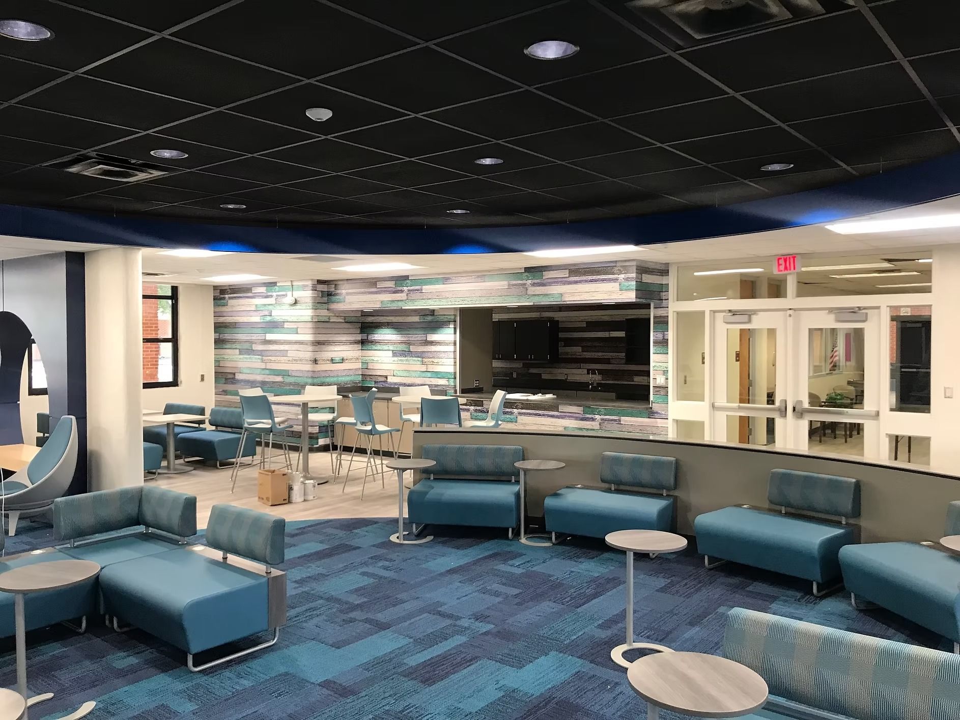 Contemporary library seating area with commercial flooring