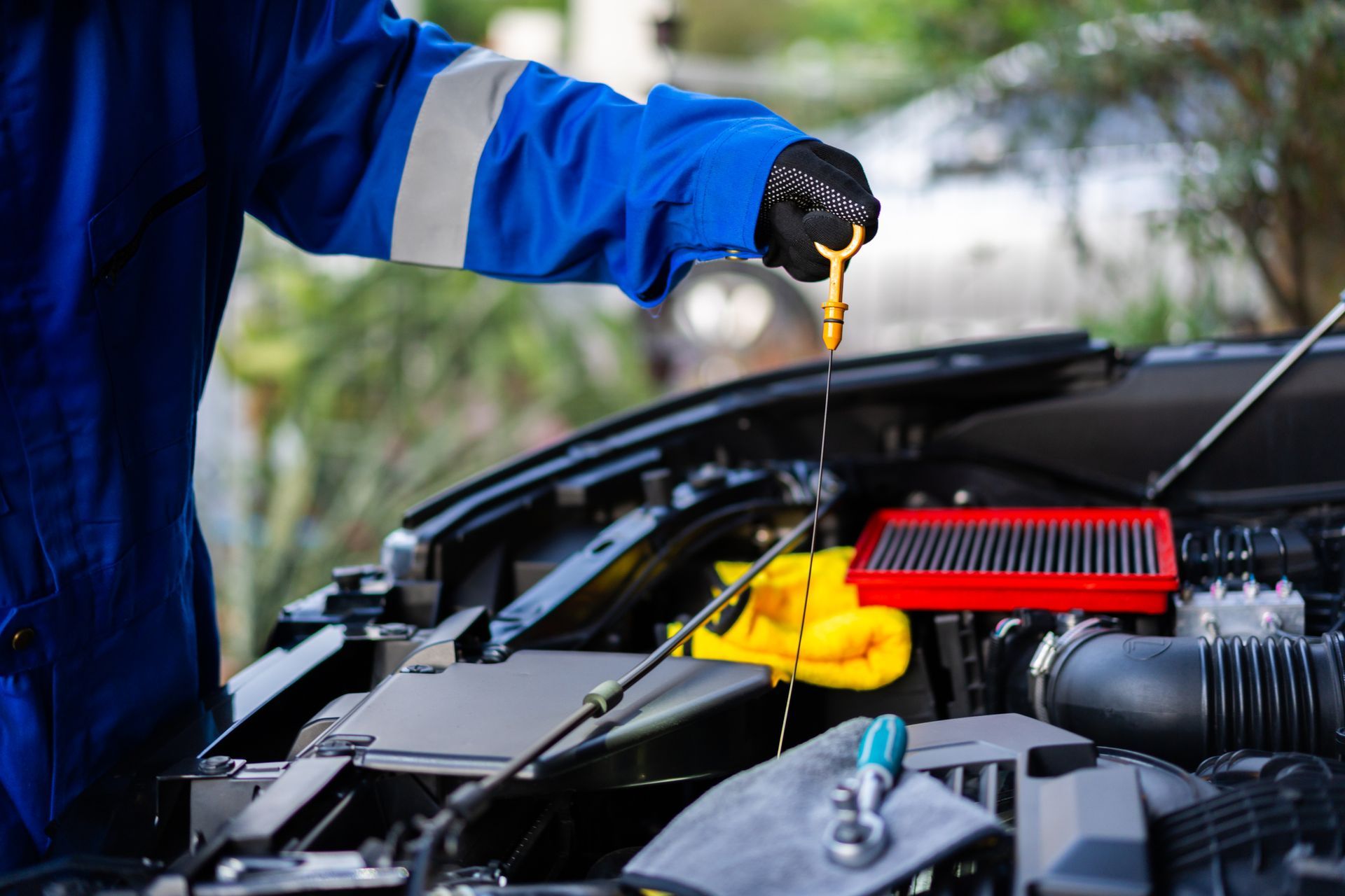 mechanic doing a car repair to a customer's car.