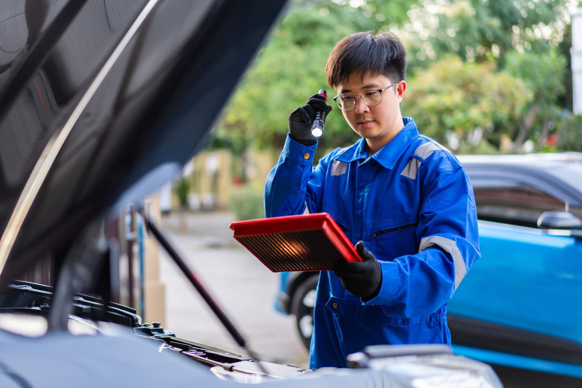 Auto mechanic service repairs a customer's car.