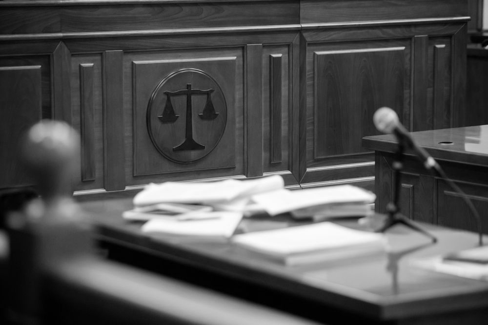 A Judge 's Bench With a Microphone — Farrell Lusher Solicitors In Wagga Wagga, NSW
