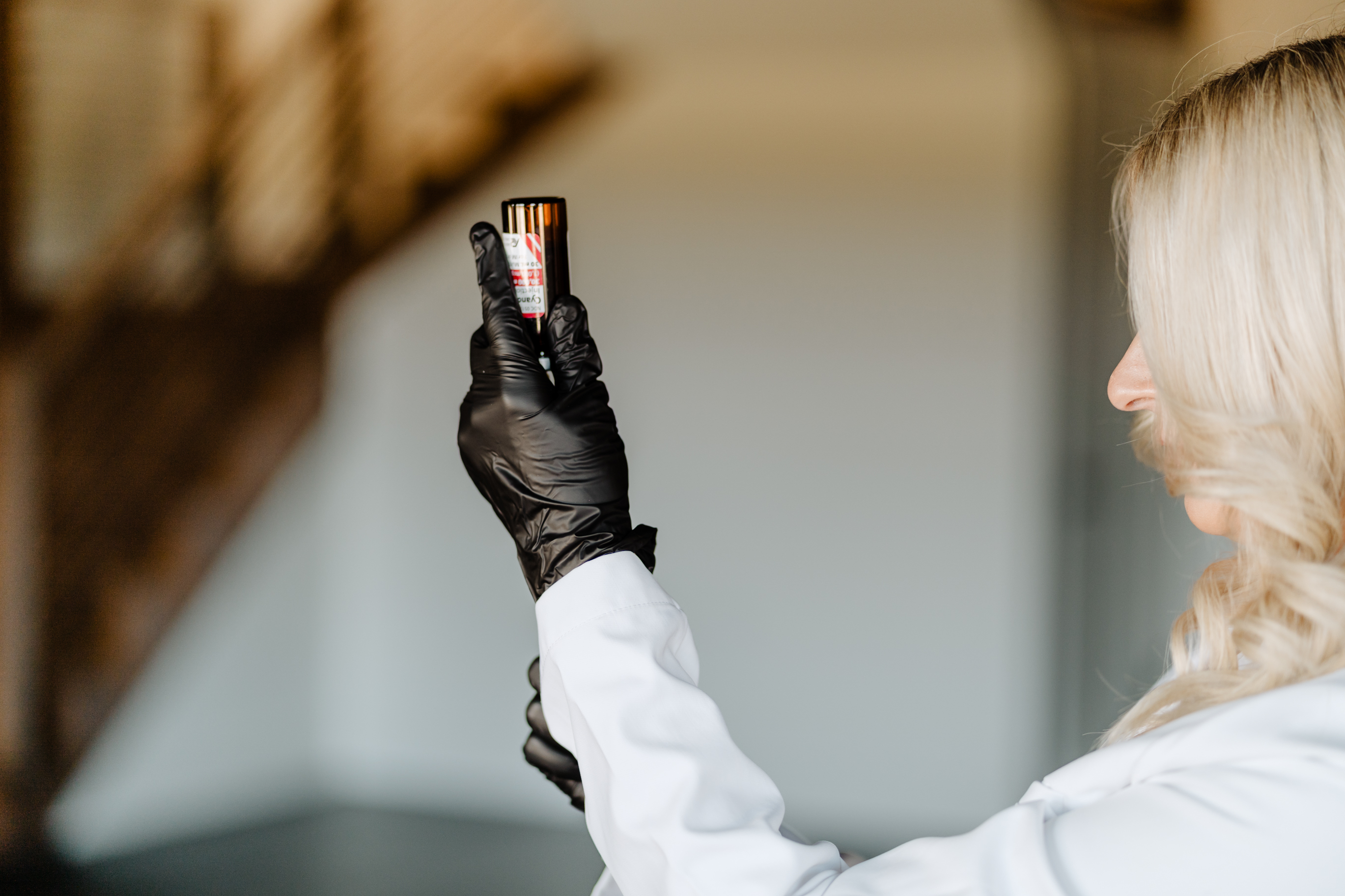 Three women are running on a gravel road.