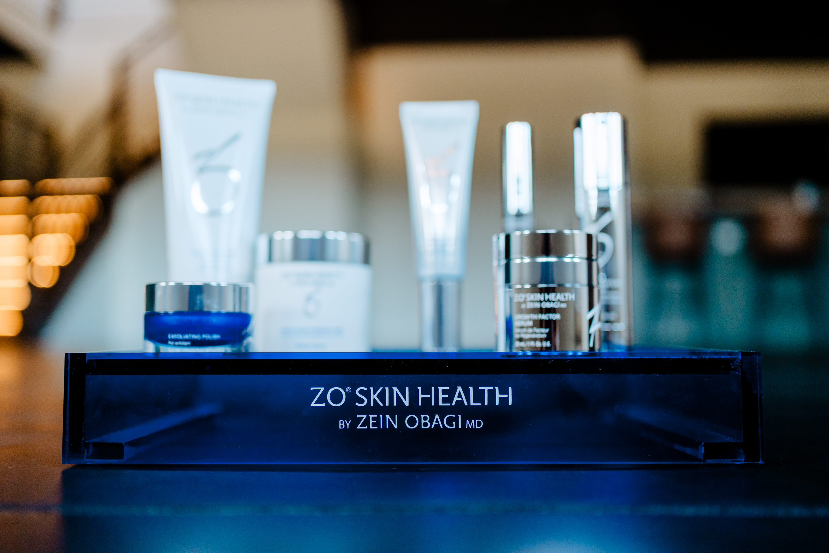 A black headband with bella glow written on it