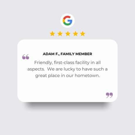 A five-star Google review from Adam F., a family member, praising a friendly, first-class facility in their hometown.
