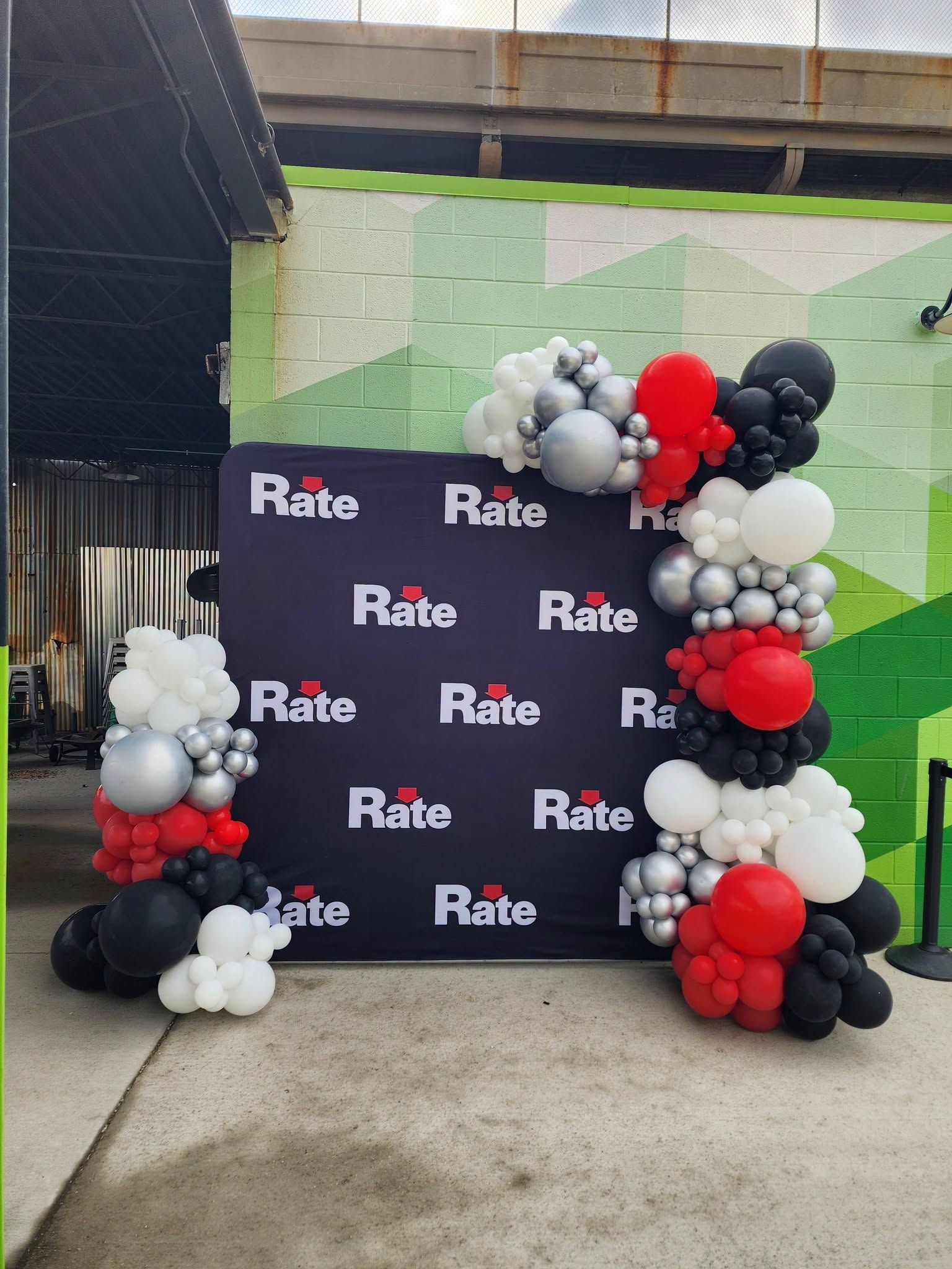 A bunch of balloons are sitting on top of a fireplace.