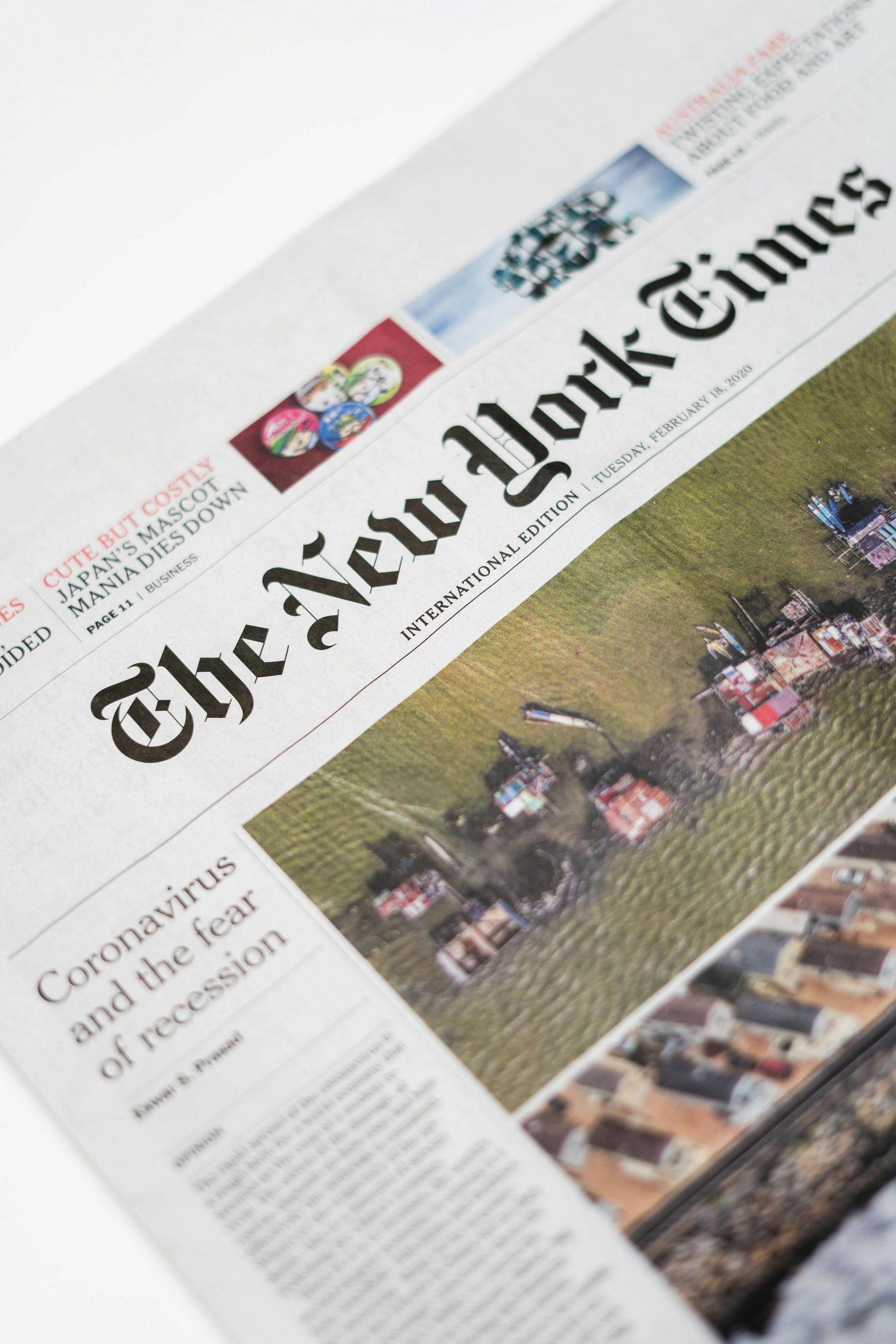 A close up of the front page of the New York Times relating to news.