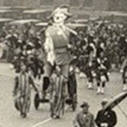 A black and white photo of a group of people riding bicycles.