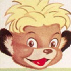 A close up of a teddy bear 's face with blonde hair