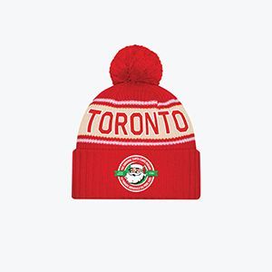 A red beanie with the word toronto on it