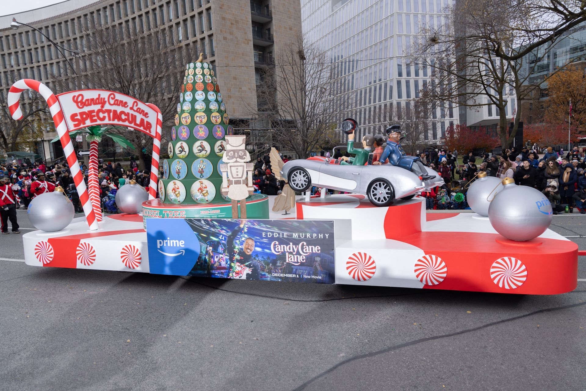 A christmas parade float with candy canes and a car