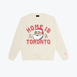 A white sweater with a picture of santa on it.