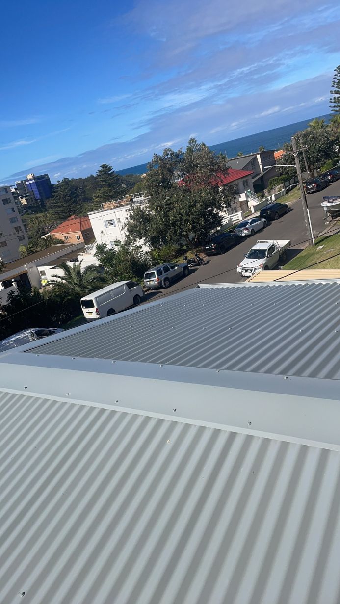 The roof of a building with a view of the ocean. — Platinum Pride Roofing In Wyoming, NSW