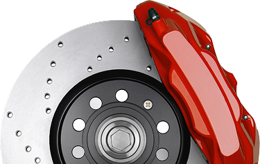 Close-up of a car brake rotor and red caliper with drilled disc holes | Beach Cities Auto Clinic