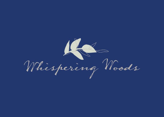 A logo for whispering woods with a leaf on a blue background