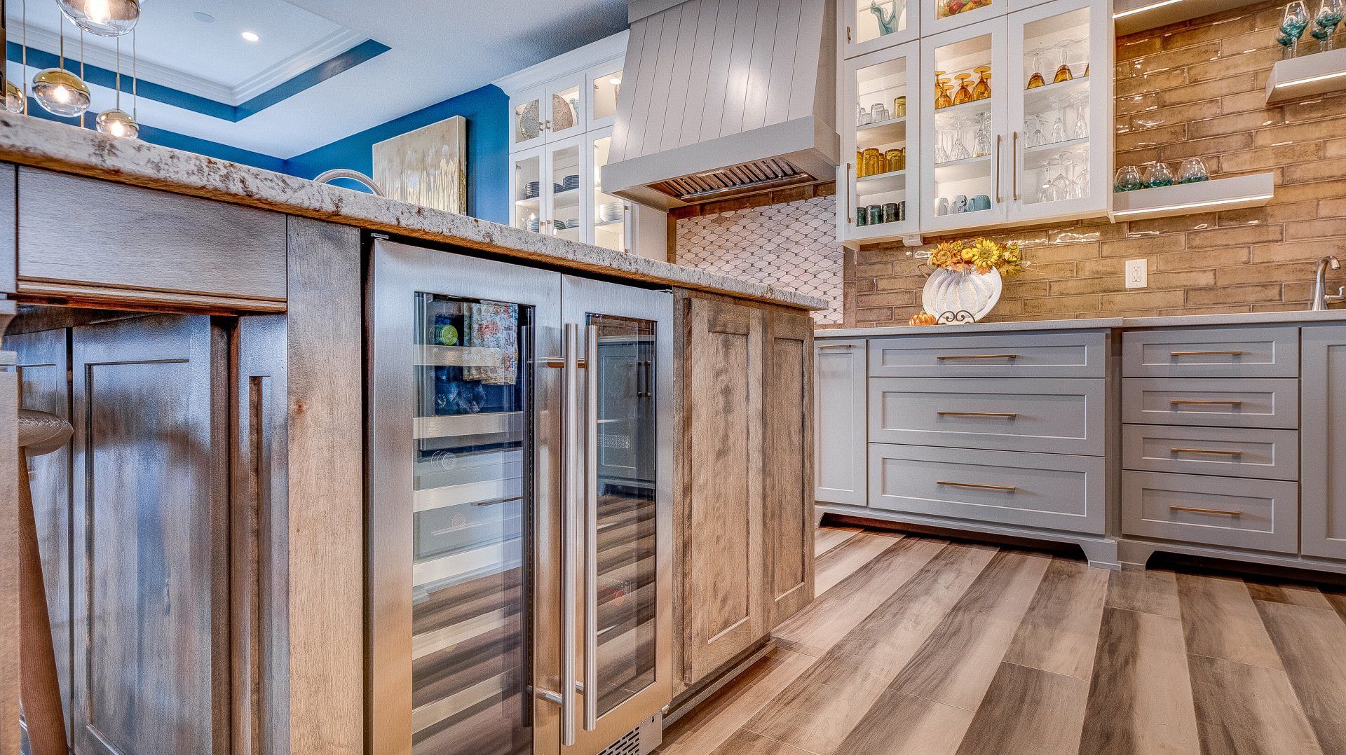 A kitchen with stainless steel appliances and wooden cabinets.
