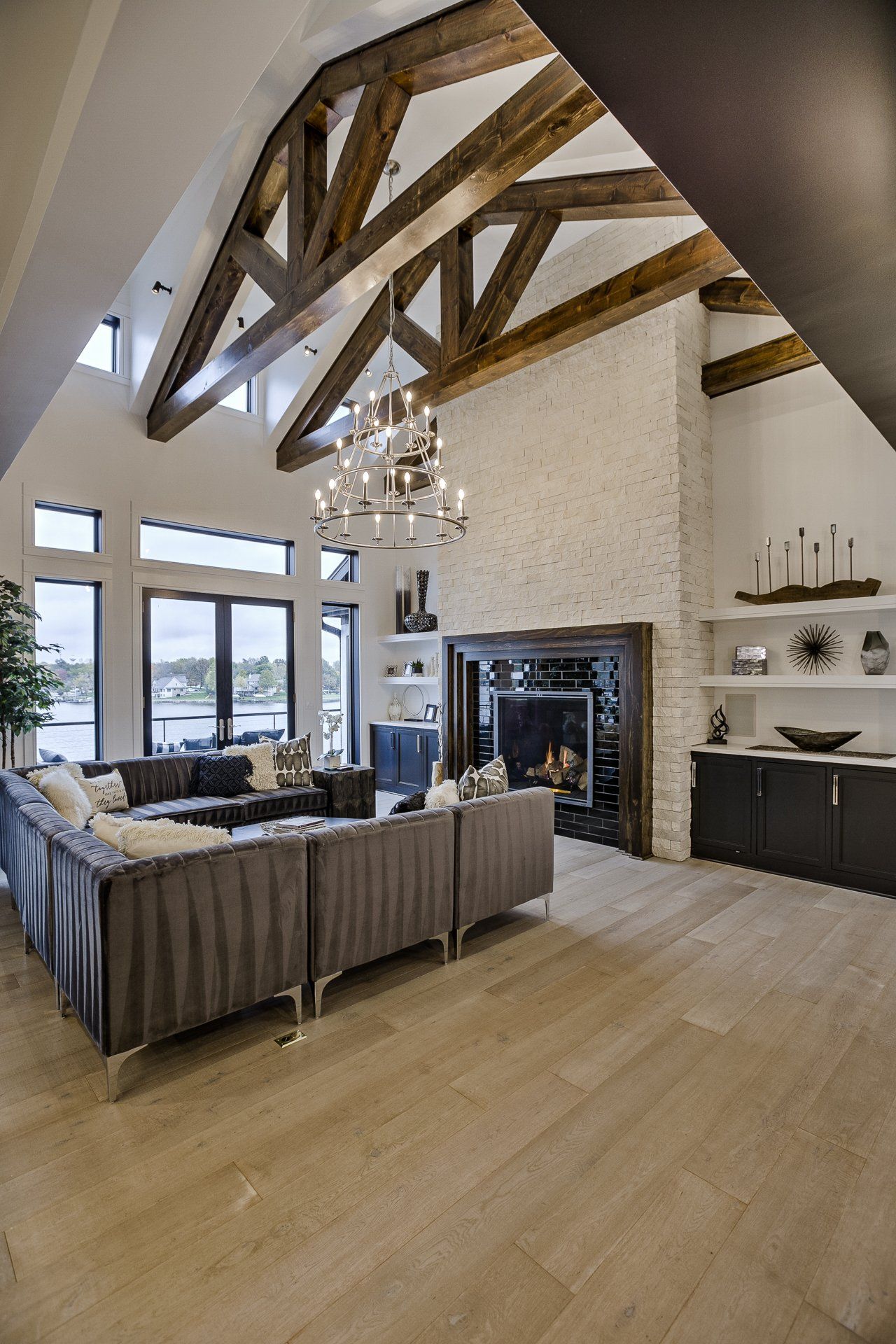 A living room with a lot of furniture and a fireplace.