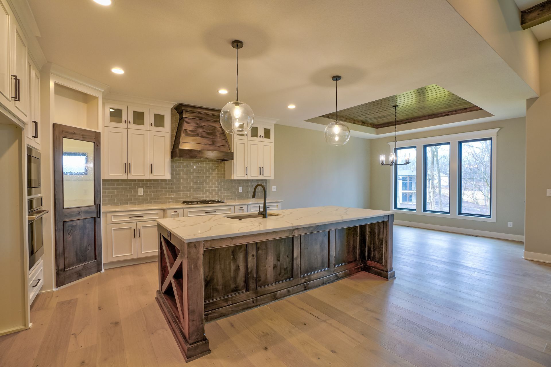 There is a large island in the middle of the kitchen.
