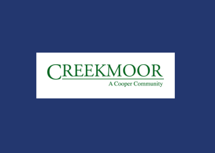 A logo for creekmoor a cooper community on a blue background