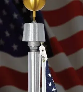 Close-up of a flagpole with an American flag blowing in the wind.