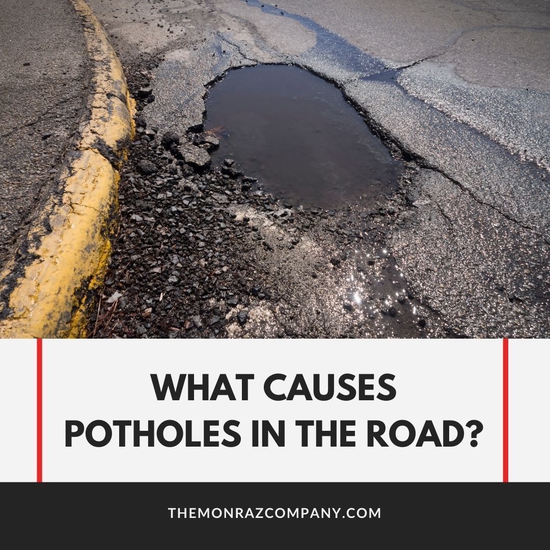 What causes potholes in the road ?