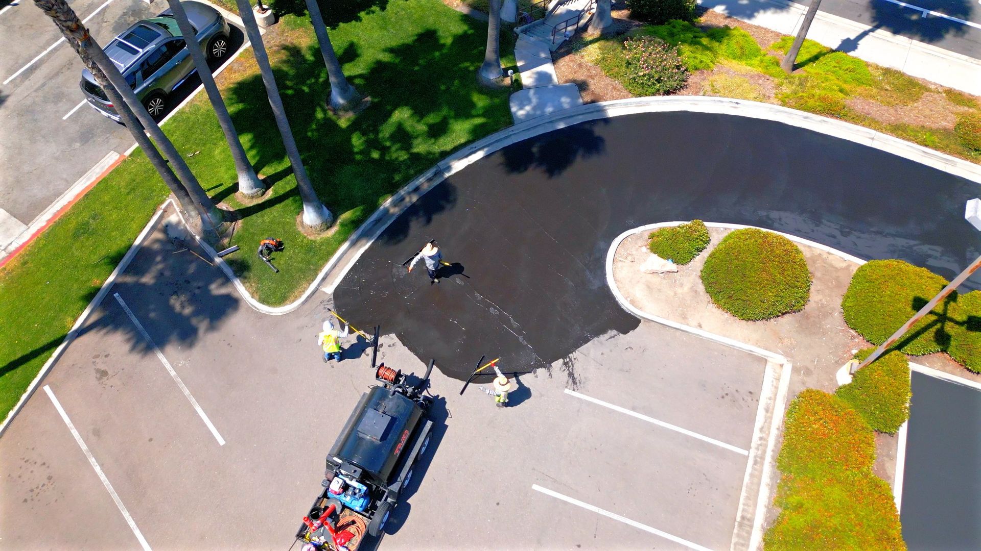 An aerial view of a car parked in a parking lot.