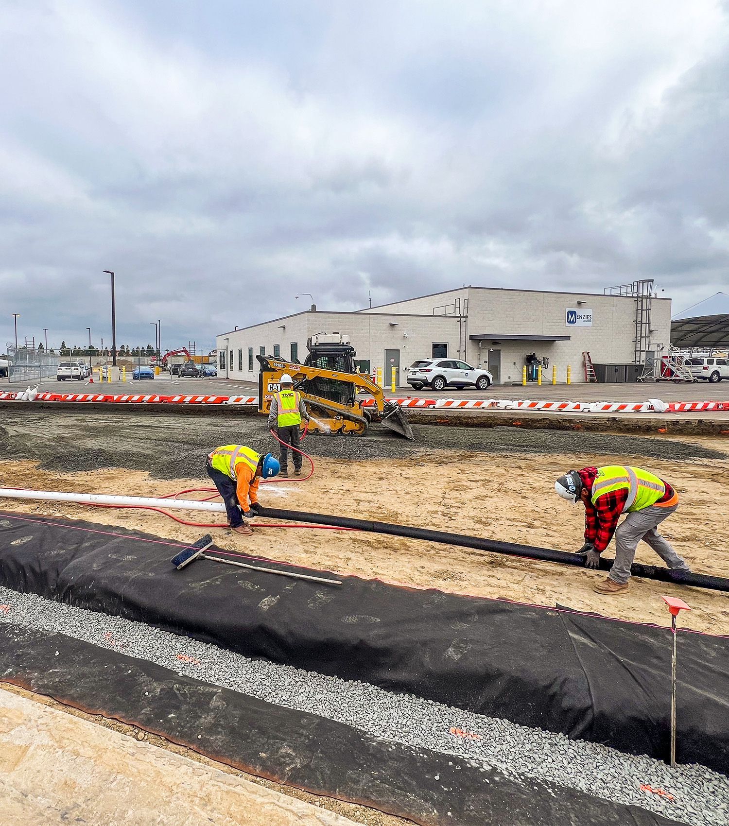 A group of construction workers are working on a construction site.