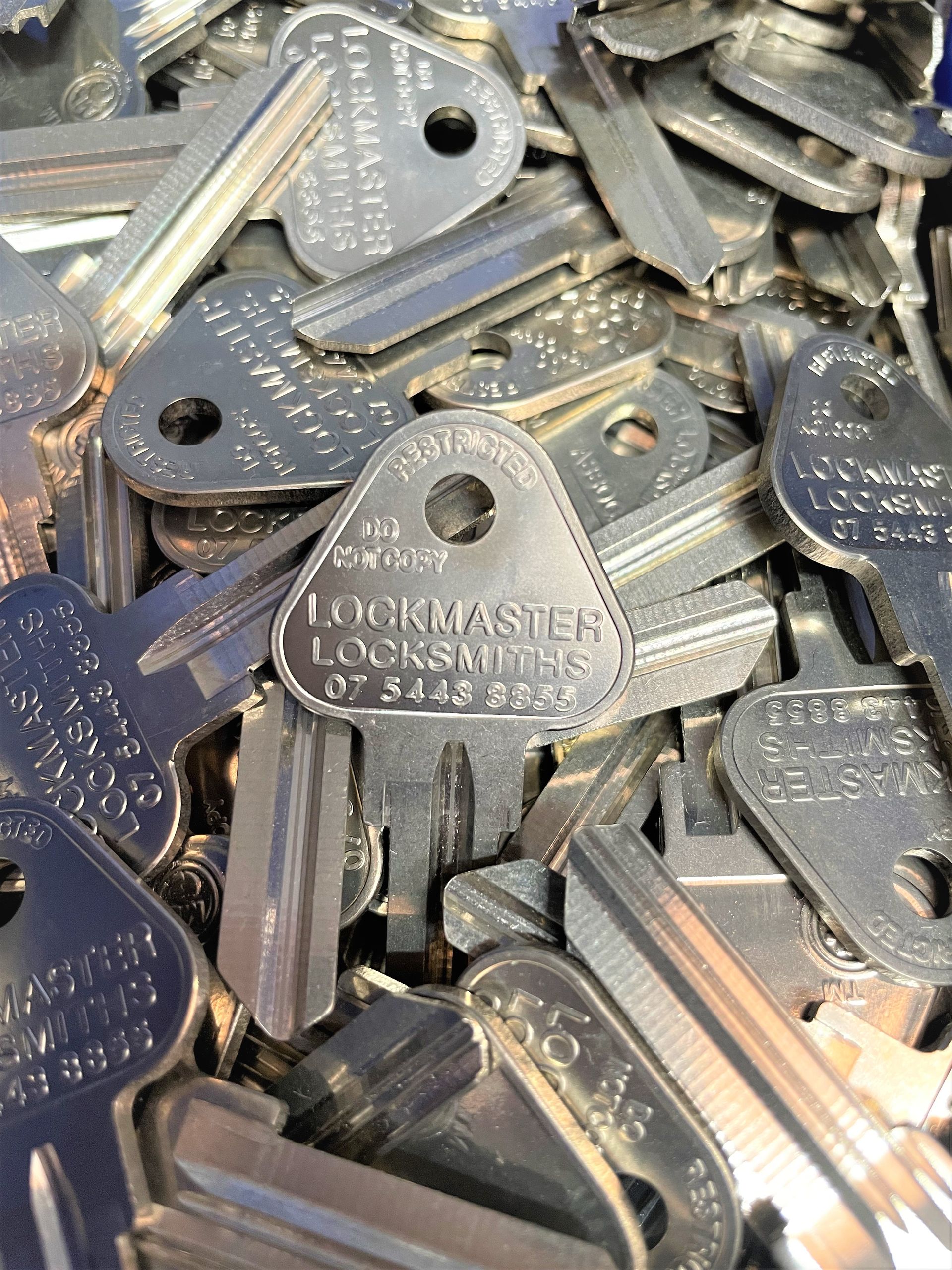 Home Key With Metal House Keychain In Keyhole — Master Keys on the Sunshine Coast, QLD