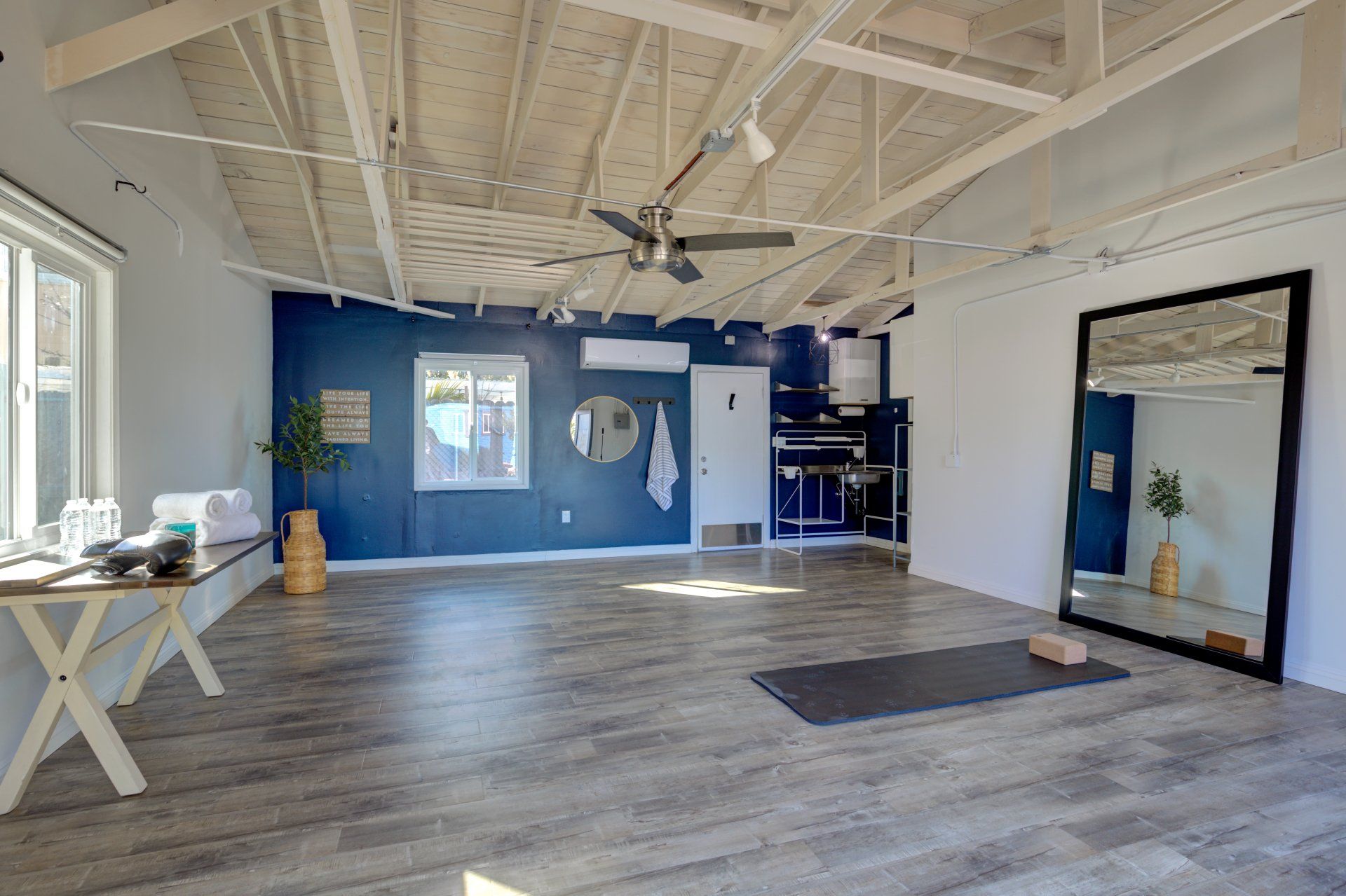 There is a yoga mat in the middle of the room.
