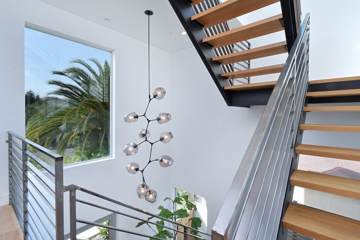 A staircase with wooden steps and a metal railing