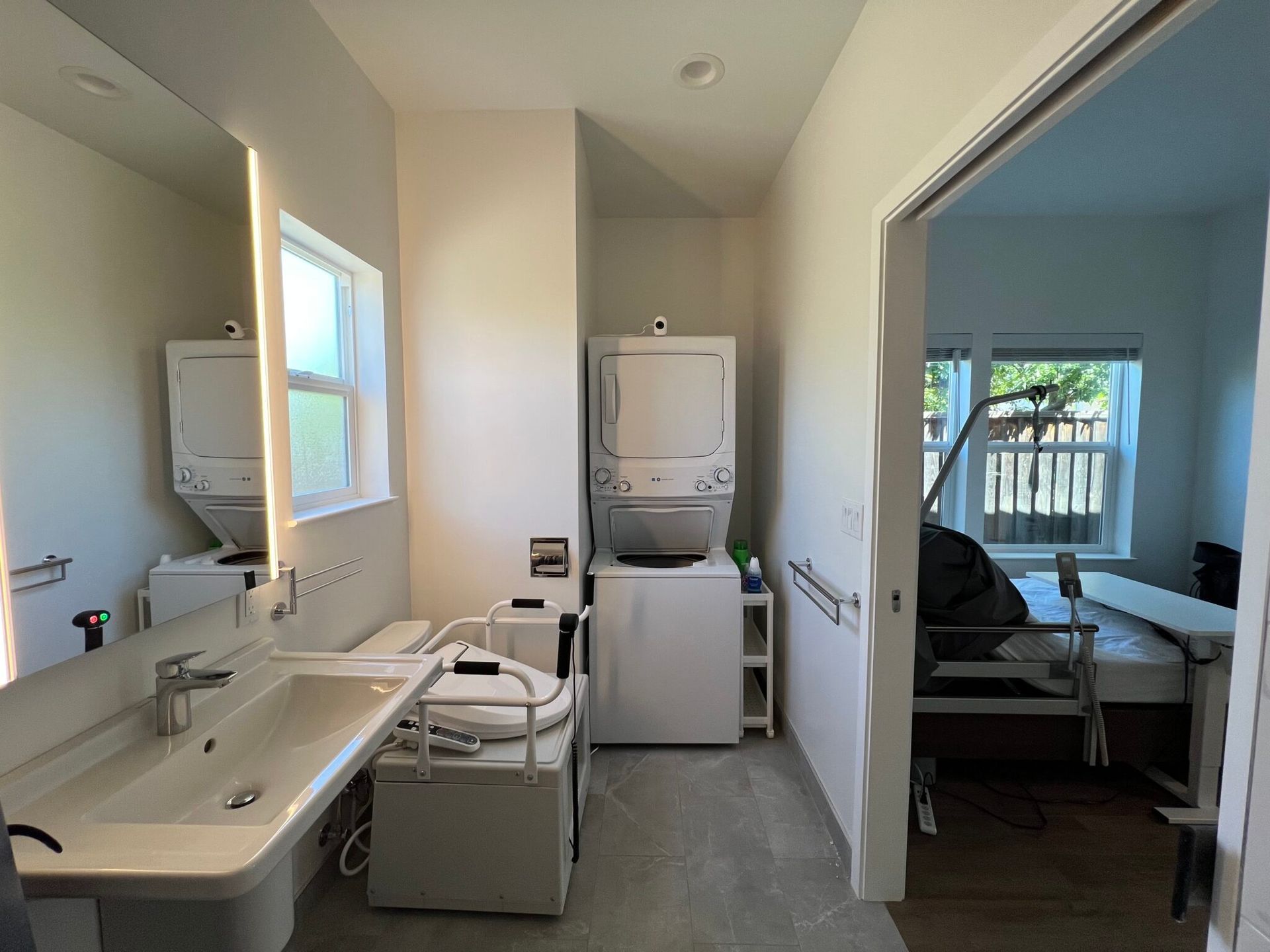 A bathroom with a sink and a washer and dryer