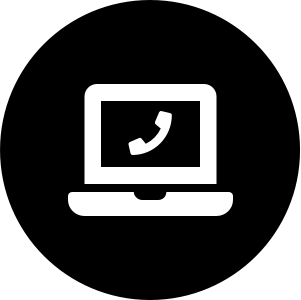 A laptop with a phone on the screen in a black circle.