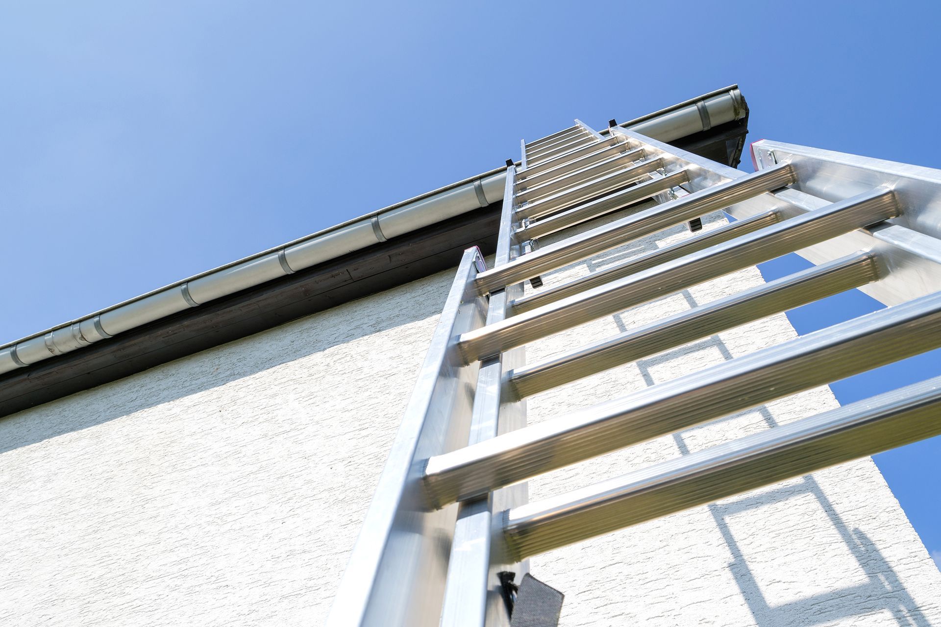 A ladder is attached to the side of a building.