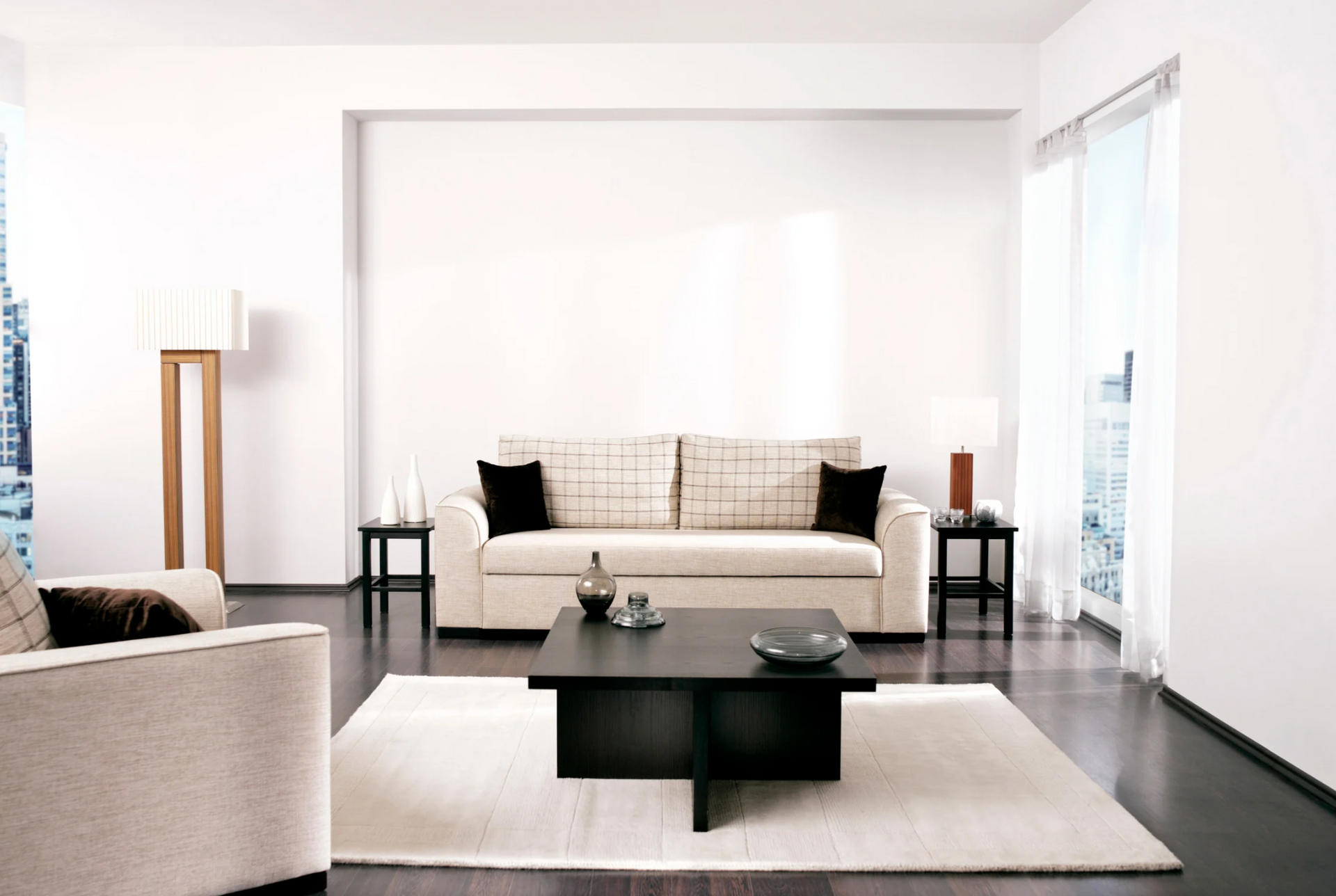 A living room with a couch a chair and a coffee table