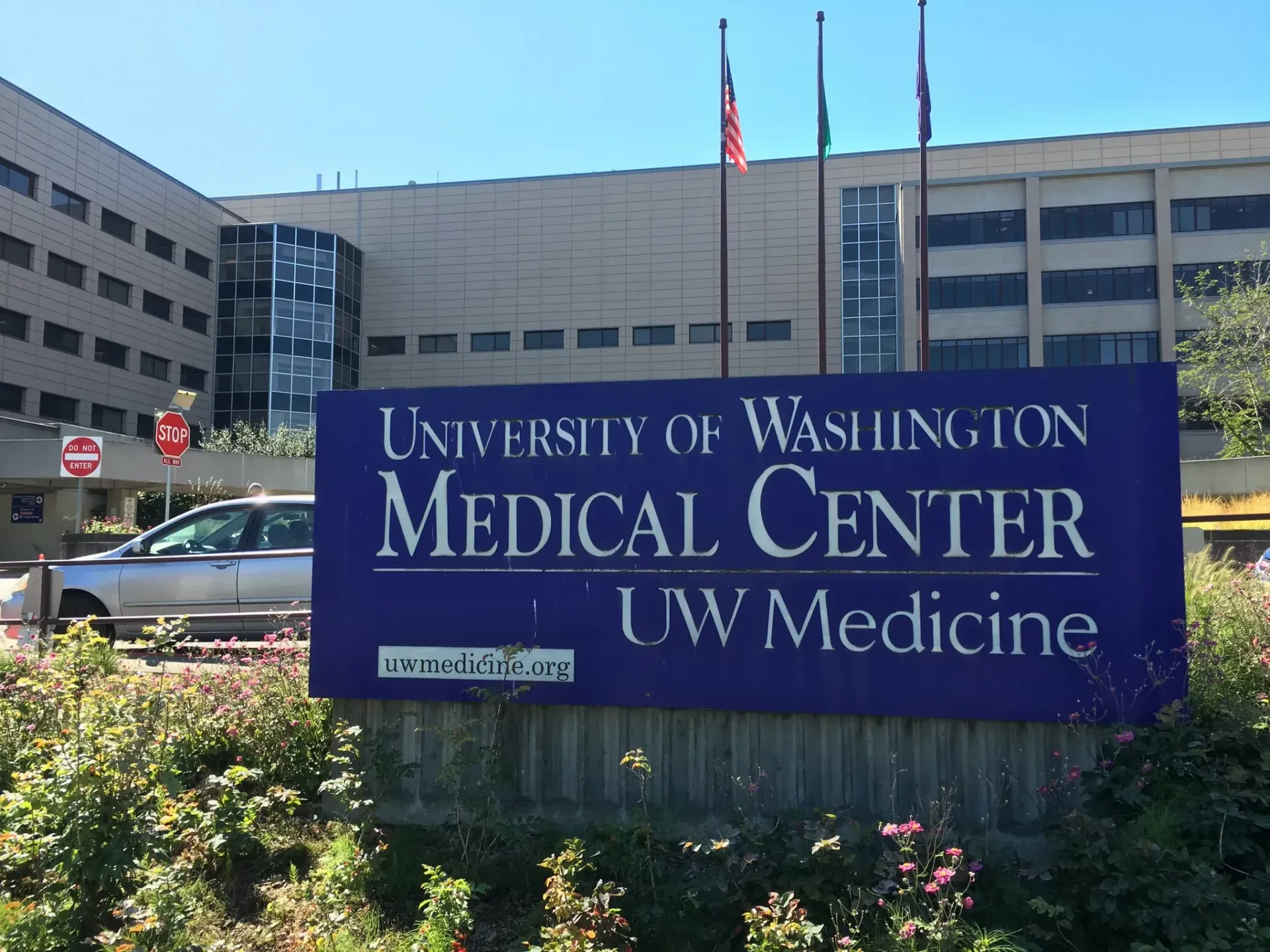 University of Washington Medical Center sign in front of hospital buildings