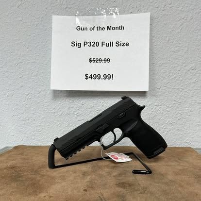 Sig P320 full size handgun on display, listed as 