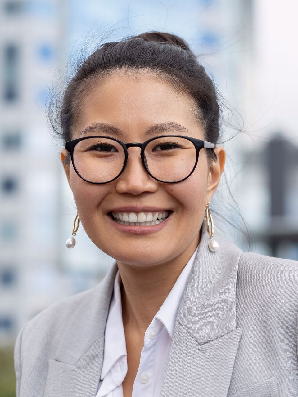 young cheerful businesswoman in eyeglasses