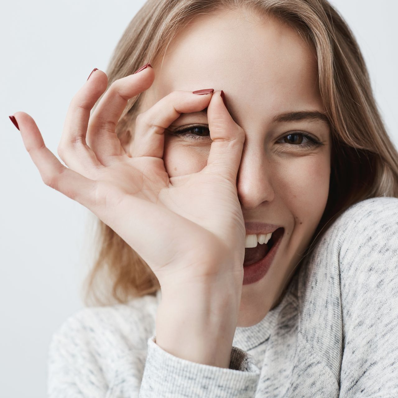 young woman with ok gesture