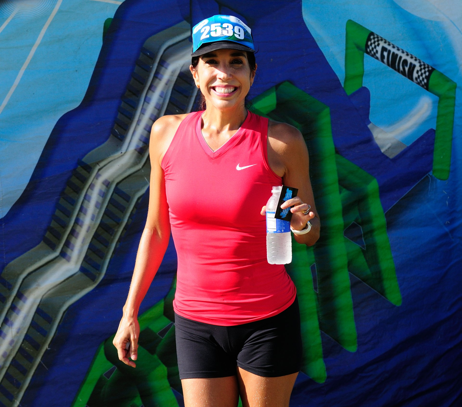 A woman wearing a hat with the number 2359 on it