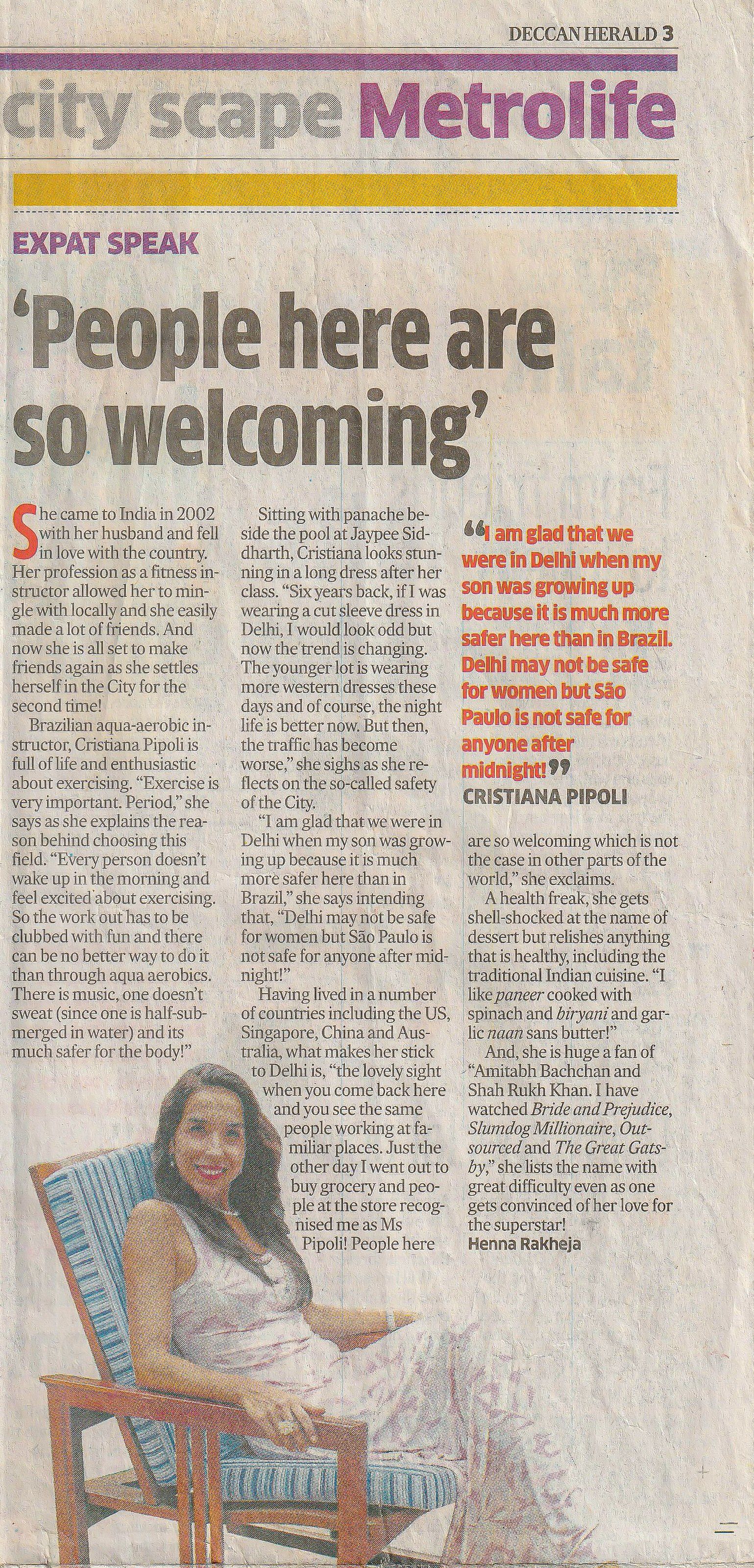 A woman is sitting in a chair in a newspaper article.