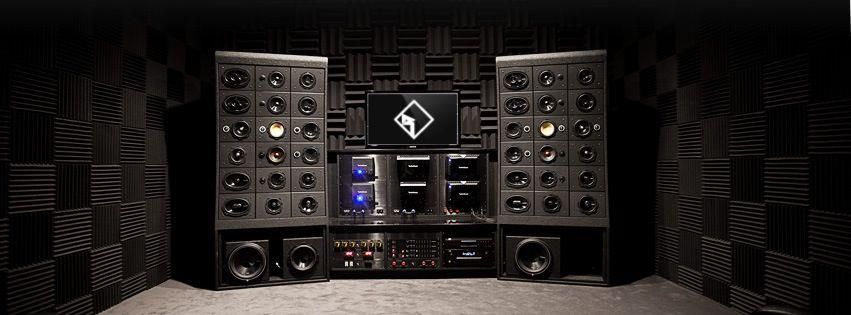 Recording studio equipment with speakers, monitors, and soundproofing.