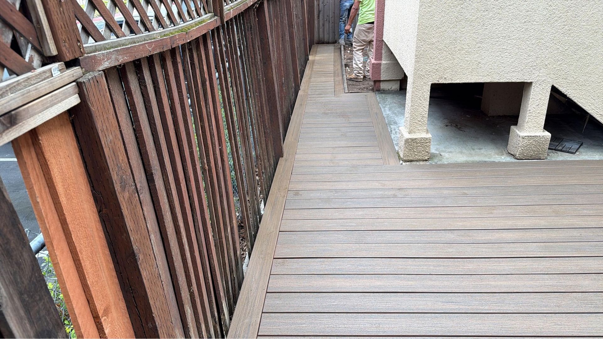 Deck renovation project featuring composite decking installation, upgraded stair system, reinforced structure, and modern outdoor finishes. Exterior remodel completed by Dream Build Services, specializing in deck construction, deck replacement, outdoor living spaces, and residential home improvements in the Bay Area.