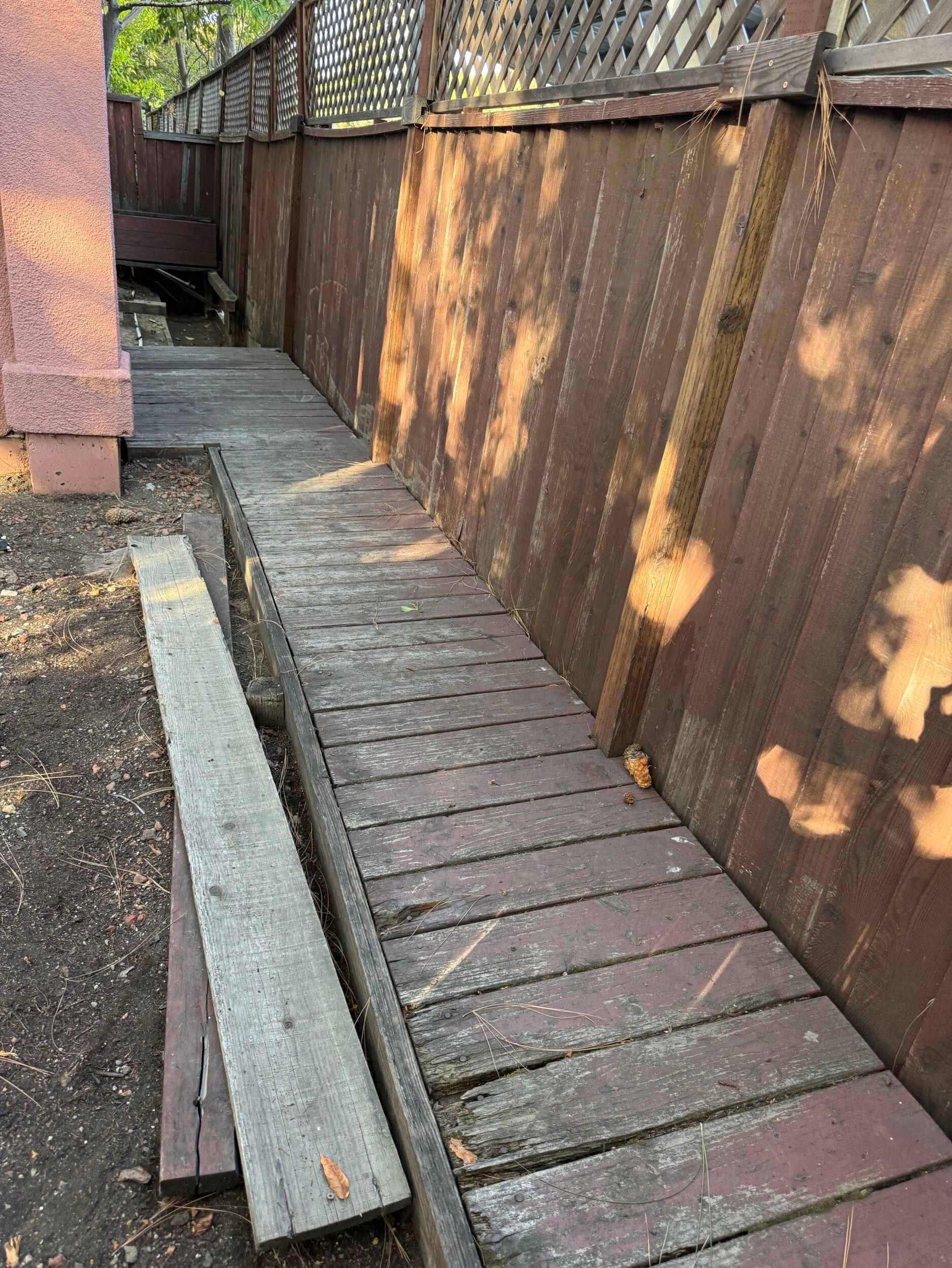 Deck renovation project featuring composite decking installation, upgraded stair system, reinforced structure, and modern outdoor finishes. Exterior remodel completed by Dream Build Services, specializing in deck construction, deck replacement, outdoor living spaces, and residential home improvements in the Bay Area.