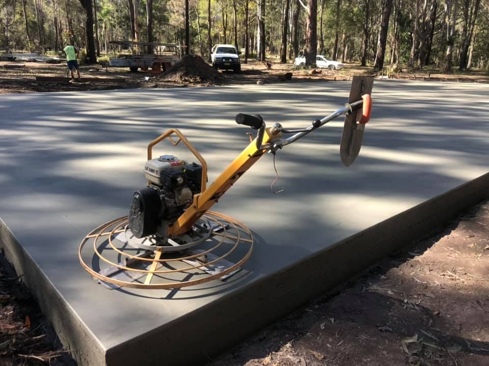 A Concrete Trowel Is Sitting On Top Of A Concrete Slab — Luke Seears Concreting in Port Macquarie, NSW