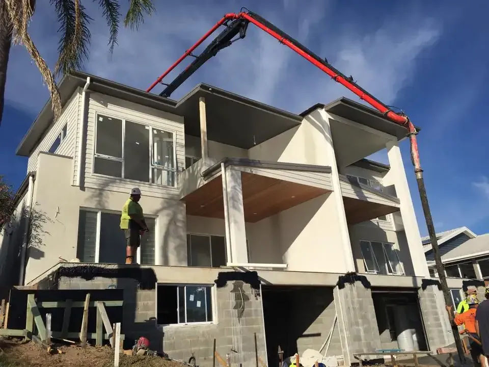 A Large House Is Being Built With A Concrete Pump — Luke Seears Concreting in Port Macquarie, NSW