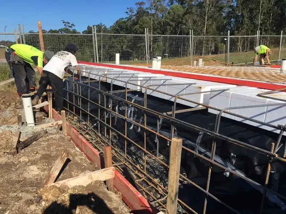A Group Of Construction Workers Are Working On A Construction Site — Luke Seears Concreting in Port Macquarie, NSW