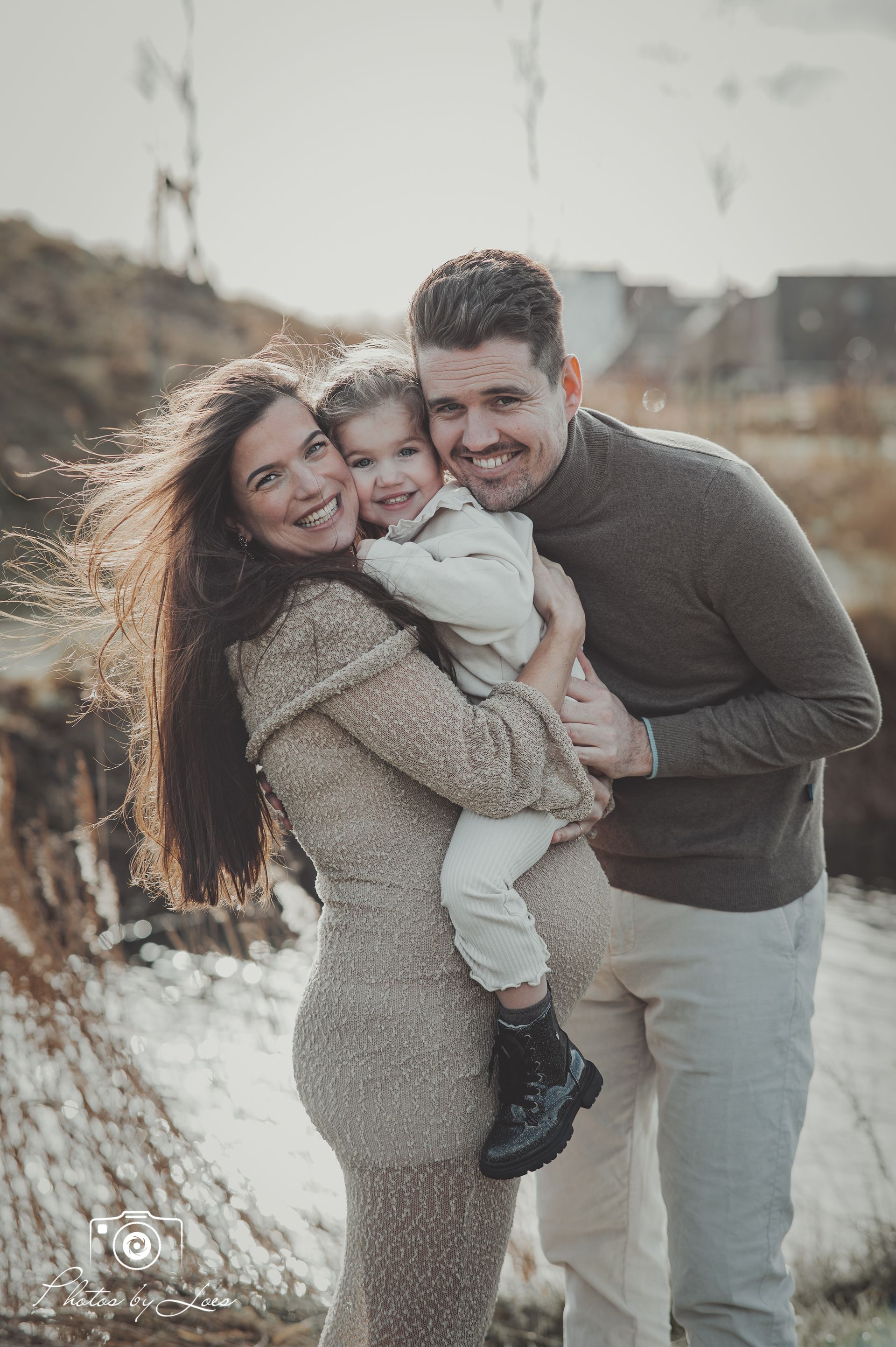 zwanger en met gezin op de foto