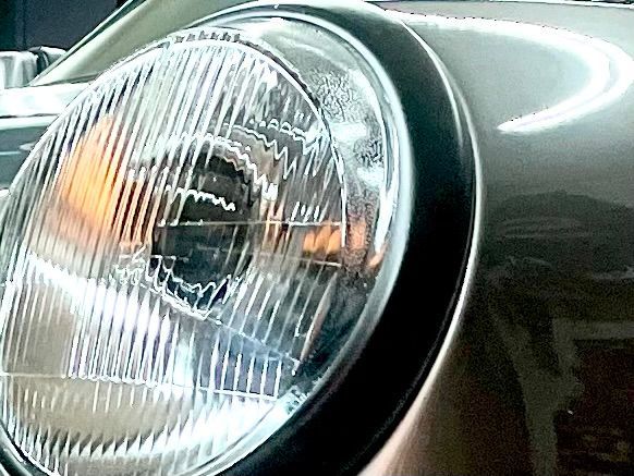 A close up of a headlight on a car