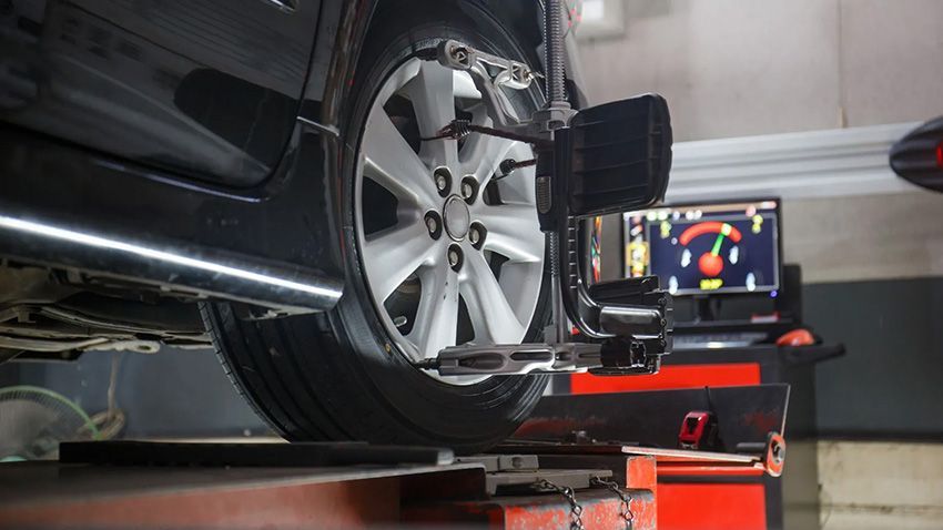 A Car is Being Aligned With a Machine in a Garage — Toowoomba Lube & Mechanical in Glenvale, QLD