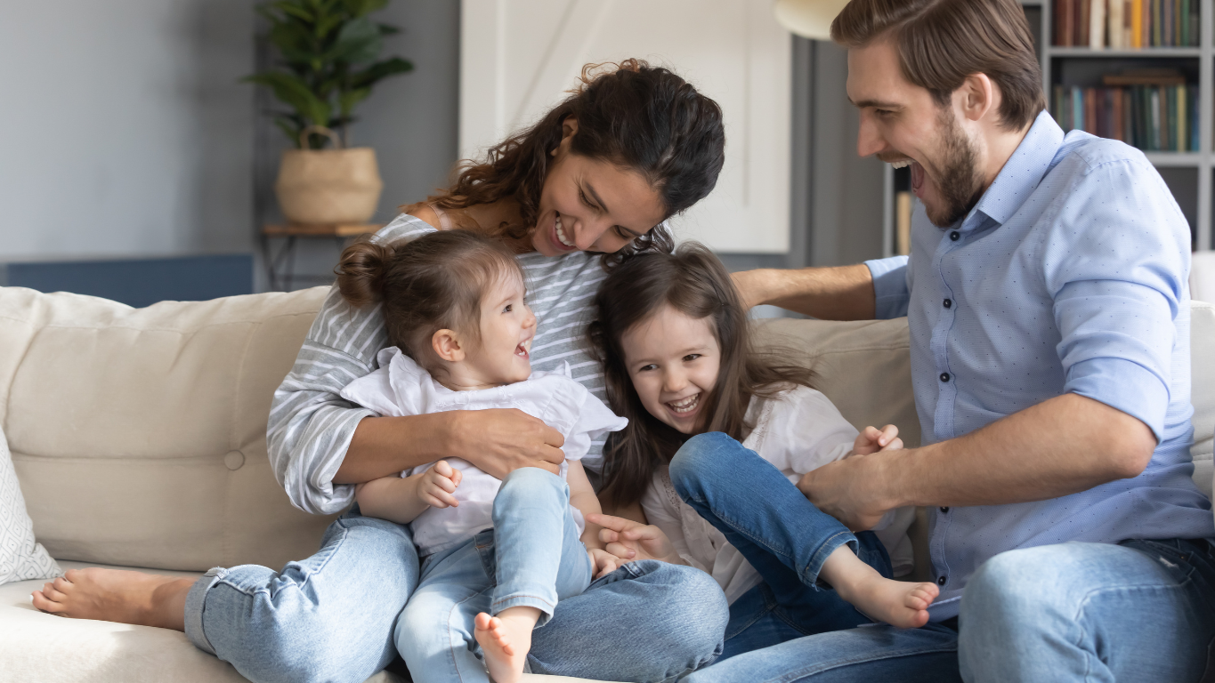 Happy family in their new home after securing a conventional home loan