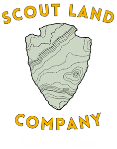 A logo for scoutland company with a shield on a white background